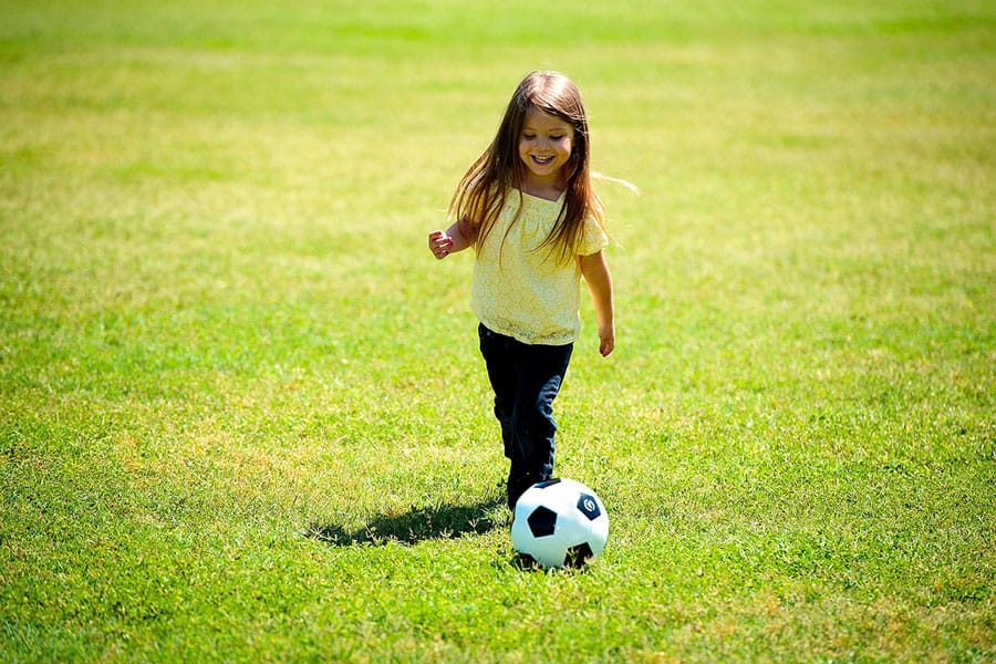 little girl playing soccer